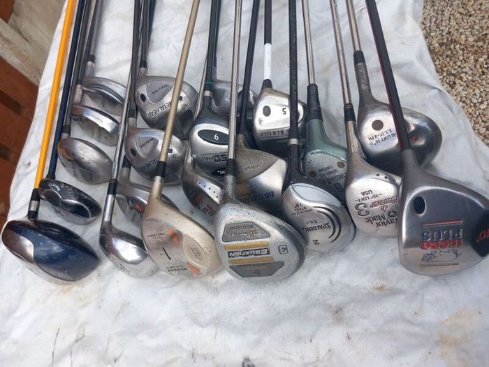 A selection of golf clubs and bags. Golf balls