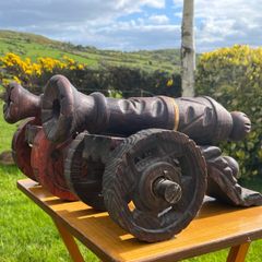 vintage large carved wooden cannons