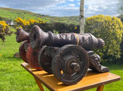 vintage large carved wooden cannons