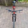 Rockrider ST 900. 24in wheels, mechanical disc brakes, front suspension forks, 8 gears. In good working order with the usual scrapes and scratches from kid use. Image 3