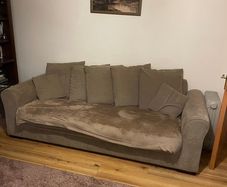 Brown three seater sofa