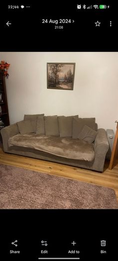 Brown three seater sofa