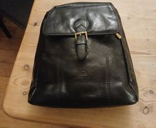 Leather knapsack.