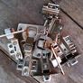 Assortment of cabinet hinges, handles, feet and fittings Image 8