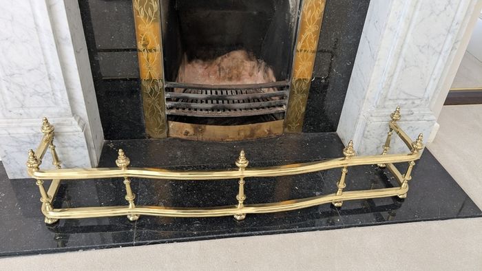 Brass fireplace fender and companion set