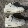 Air Jordan 4 White and Gold Trainers Image 3