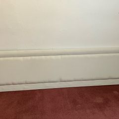 Neutral-coloured padded headboard