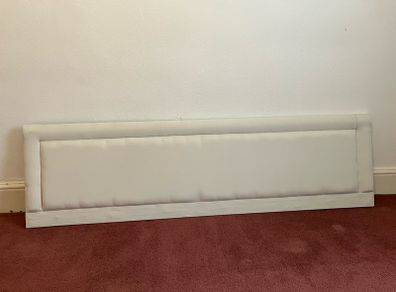 Neutral-coloured padded headboard