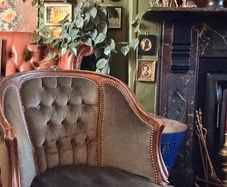 French walnut and green velvet armchair