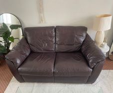 Leather couch comfortable with some marks
