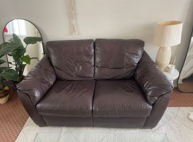 Leather couch comfortable with some marks