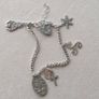 Vintage sterling silver bracelet with charms. Please note that only one charm is not sterling silver. It is a small size, approximately 16/17 cm. Image 3