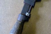 Very small wooden handled adjustable wrench