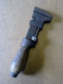 Very small wooden handled adjustable wrench