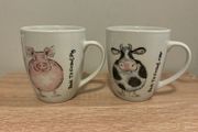 A Pair of Porcelain Cow and Pig Mugs