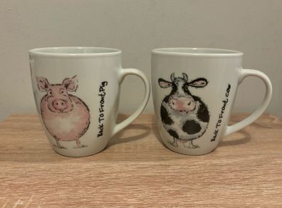 A Pair of Porcelain Cow and Pig Mugs