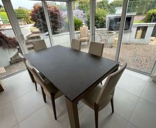 Bronze Ceramic Table & Leather Chairs