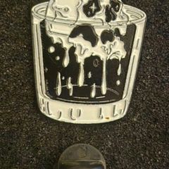 Skull, pin back badge.