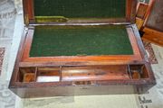 19th Century Victorian writing slope. It features a hinged lid that opens to create a sloped writing surface, traditionally lined with velvet. The box includes built-in compartments for storing pens, inkwells, and documents., postage available