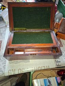 19th Century Victorian writing slope. It features a hinged lid that opens to create a sloped writing surface, traditionally lined with velvet. The box includes built-in compartments for storing pens, inkwells, and documents., postage available