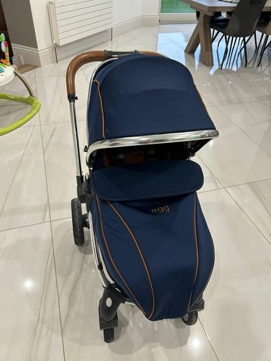 Navy egg carrycot and also Converts to a tandem pushchair