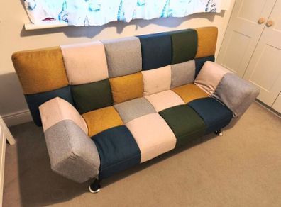 Sofa bed with mattress topper