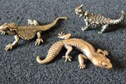 3 brass lizards.