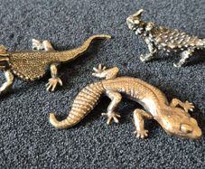 3 brass lizards.