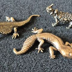 3 brass lizards.