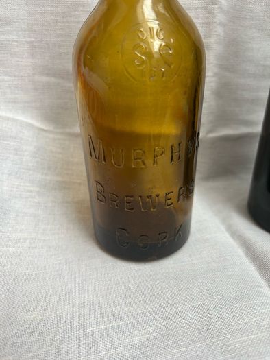 Antique Cork Advertising Bottles x2