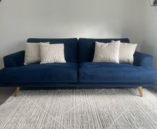 Navy velvet sofa and cuddle chair from Michael Murphy furniture