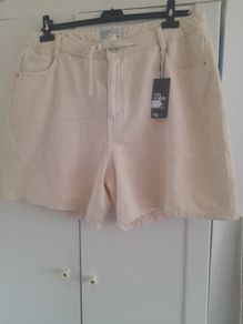 New with tags ladies cream denim shorts.