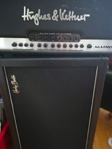 Hughes & Kettner Matrix 100 solid-state guitar amp head paired with a speaker cabinet.
