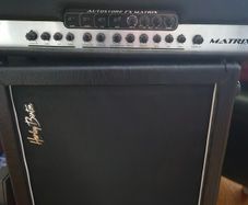 Hughes & Kettner Matrix 100 solid-state guitar amp head paired with a speaker cabinet.
