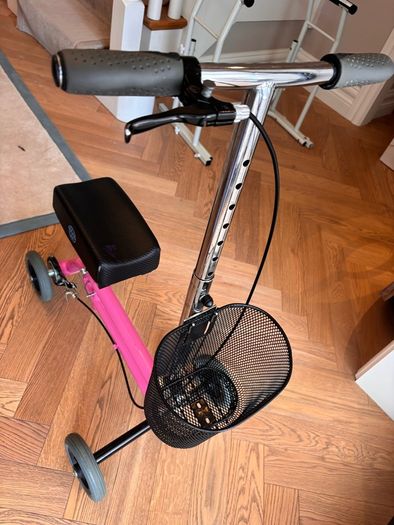 Kneerover Junior mobility knee scooter in pink. Well-used, but still working well!