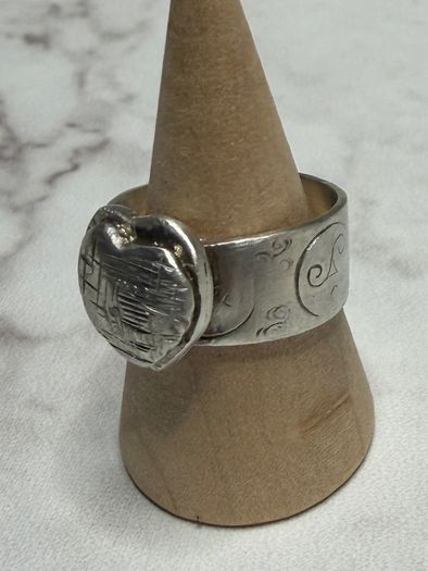 Handmade sterling silver love heart ring with trickles on the wide band. Size R
