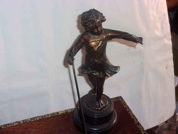 antique metal figure of a shepherd