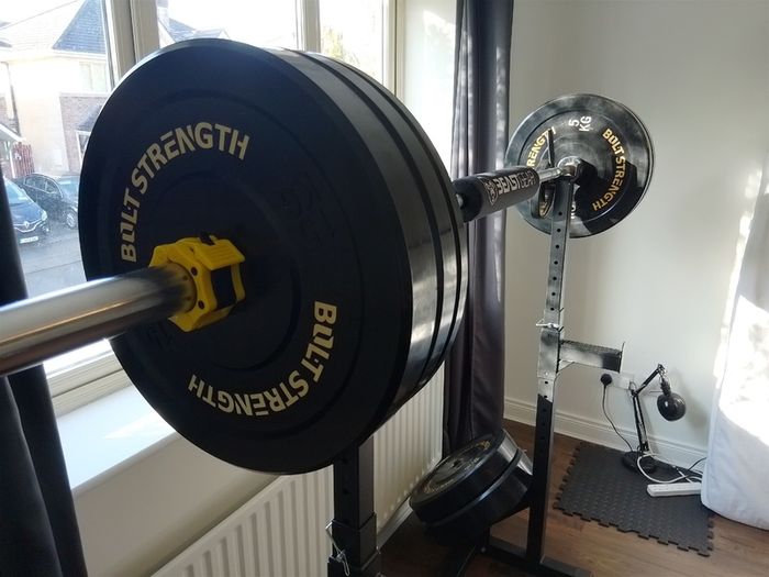 155kg Bumper Plate Set 7ft Olympic Bar and adjustable Squat Stands.