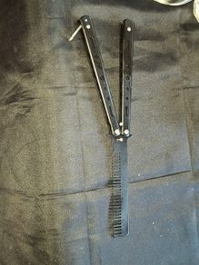 Black Steel Butterfly Comb designed for styling hair and beards