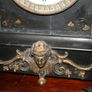 Victorian French Black Slate Mantle Clock (Very large and heavy) with bronze ornamentation Oversized. Open escarpment slate plate Roman numerals. Circa 1890s. Accented with Trojan head. Flanked by two Hellenistic ladies heads on sides. Rose cartouche mask Image 9
