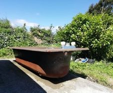 Cast iron brown bath with fittings, brown Royal Dalton toilet and cistern, brown wash hand basin with taps.