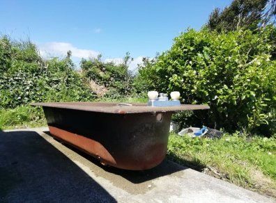 Cast iron brown bath with fittings, brown Royal Dalton toilet and cistern, brown wash hand basin with taps.