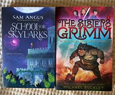 2 Children's Books . Suit 8/ 10  Plus . The Sisters Grimm & School for Skylarks.