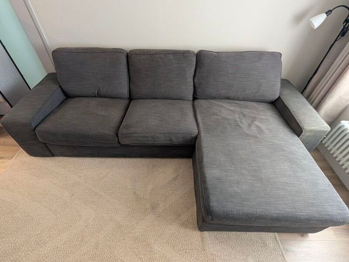 IKEA KIVIK 3-seater sofa with chaise in dark grey.
