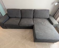 IKEA KIVIK 3-seater sofa with chaise in dark grey.