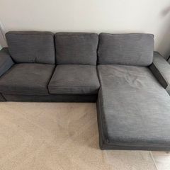 IKEA KIVIK 3-seater sofa with chaise in dark grey.