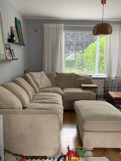 Corner sofa with footstool
