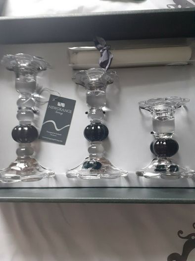 Newgrange candle holders .New in box black and glass .Would make a lovely gift