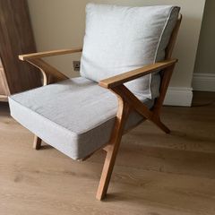 Acacia wood lounge armchair with grey cushions