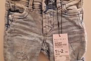 A selection of brand new baby clothes and items